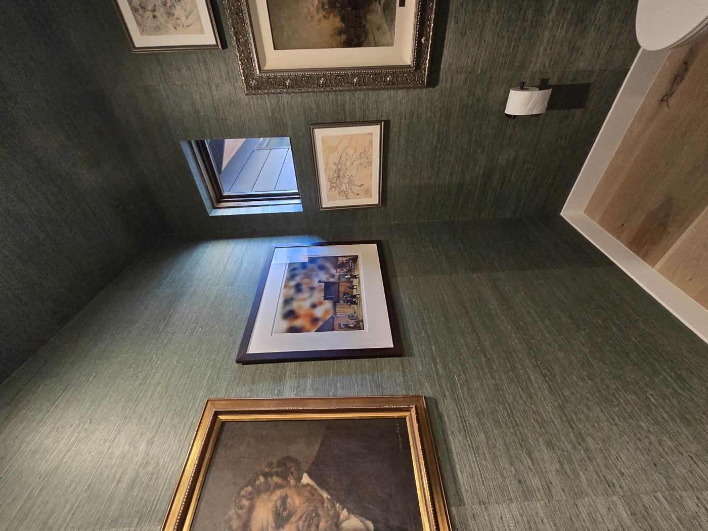Dark teal grasscloth gallery wall